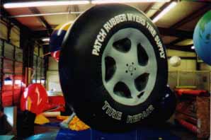 10' tire helium inflatable with artwork - all types of advertising balloons available.